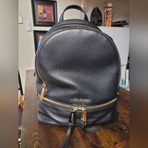 MICHAEL Michael Kors Rhea Zip Black Leather Medium size Backpack.